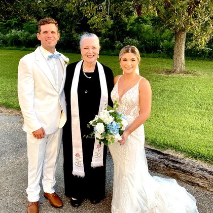 Sarah with a couple on a garden path